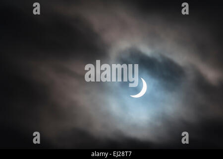 The partial solar eclipse on the 20th March 2015 seen through the clouds from north-west England. Stock Photo