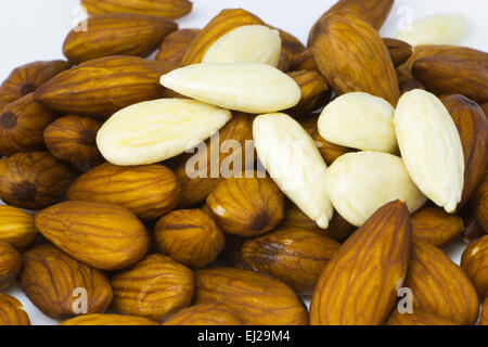 Plenty of sweet almonds with and without shells Stock Photo