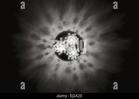 Glowing chandelier with three lamps on ceiling Stock Photo