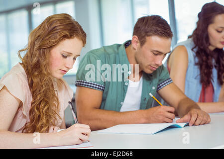 Fashion students taking notes in class Stock Photo