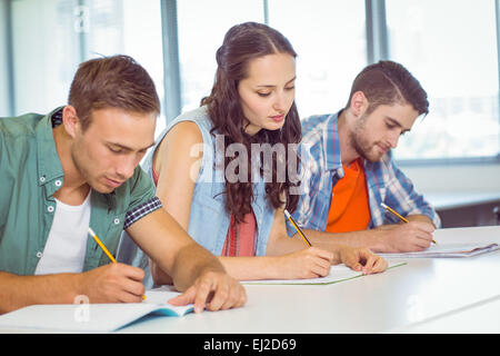 Fashion students taking notes in class Stock Photo
