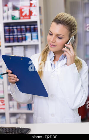 Young pharmacist on the phone Stock Photo