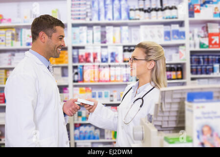Team of pharmacists holding medecines Stock Photo
