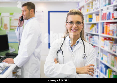 Pharmacist smiling with Pharmacist on the phone Stock Photo