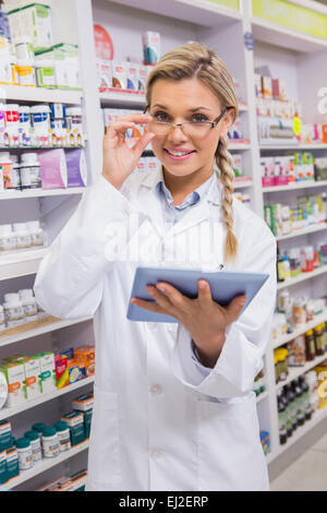 Smiling student using tablet pc Stock Photo