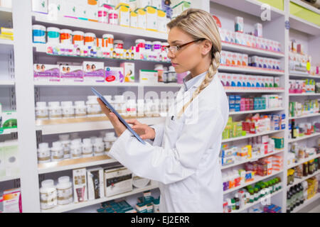 Concentrated student using tablet pc Stock Photo