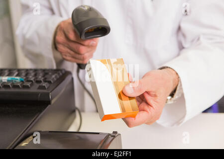 Pharmacist scanning medication with a scanner Stock Photo