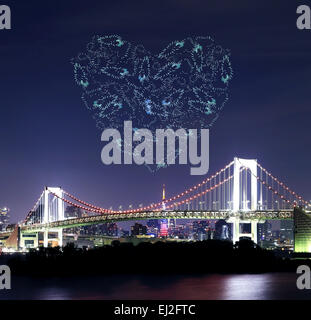 heart sparkle Fireworks celebrating over Tokyo Rainbow Bridge at Night, Odaiba, Japan Stock Photo