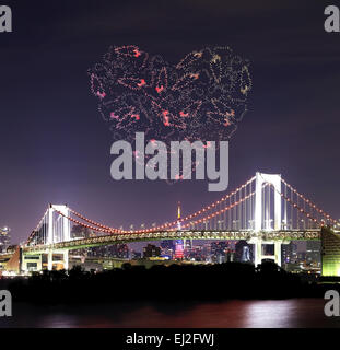 heart sparkle Fireworks celebrating over Tokyo Rainbow Bridge at Night, Odaiba, Japan Stock Photo