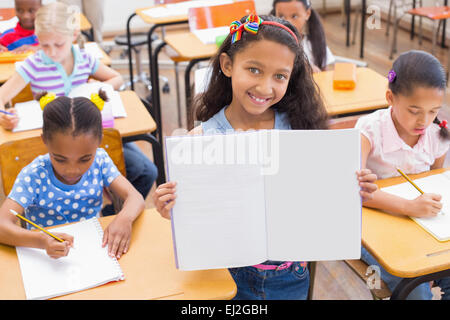 Pupil smiling at camera during class Stock Photo - Alamy