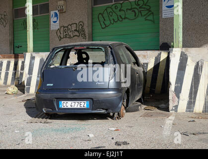 abandoned car with smashed glass, Italy Stock Photo