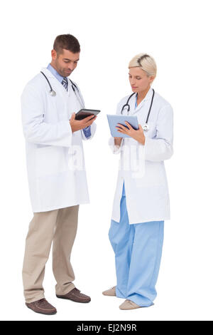 Doctors discussing something on clipboard Stock Photo