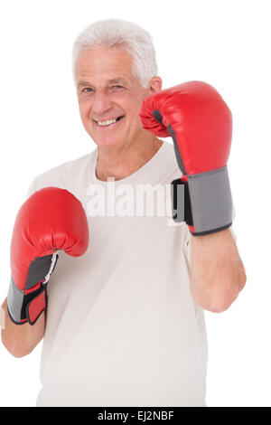 Senior man in boxing gloves Stock Photo