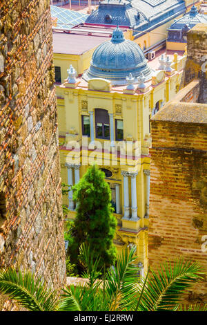 elegant yellow houses with green windows in the city of Malaga, Spain Stock Photo