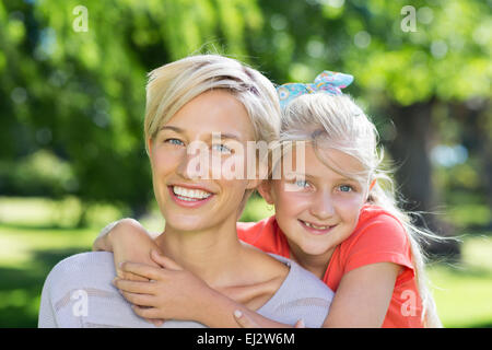 Pretty blonde with her daughter in the park Stock Photo