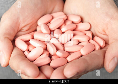 many pills in the hands. medicine concept Stock Photo