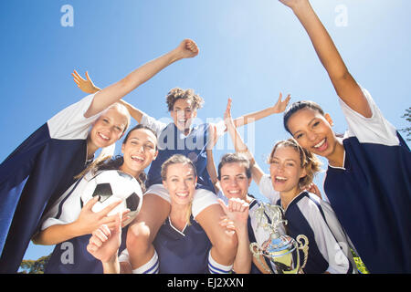 Pretty football players celebrating their win Stock Photo