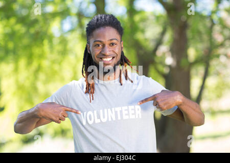 Happy volunteer in the park Stock Photo