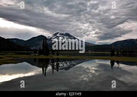 OR01762-00...OREGON - South Sister reflecting in Sparks Lake at sunset on a cloudy day in Deschutes National Forest. Stock Photo