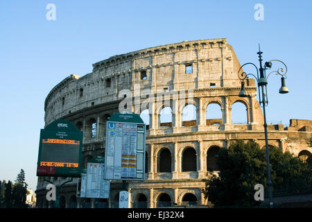 Rome, Italy. The colosseum with bus timetables in front Stock Photo