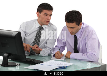 Businessmen working on project Stock Photo