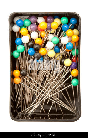 Box full of sewing needles on a white background Stock Photo