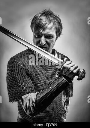Angry medieval knight armor with a sword and shield, black and white ...