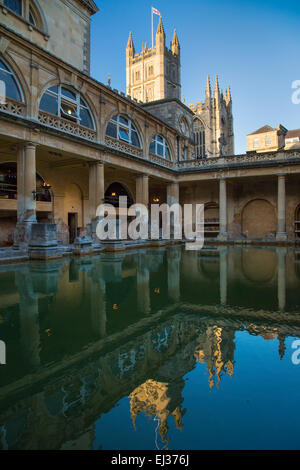 Great Bath at the Roman Baths with the Bath Cathedral beyond, Bath, Somerset, England, UK Stock Photo