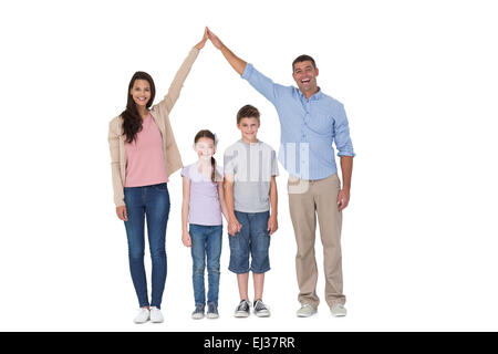 Happy parents joining hands above children Stock Photo