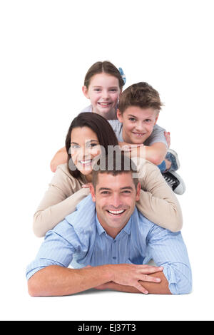 Family lying on top of each other Stock Photo