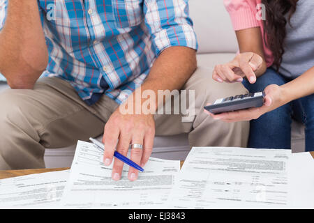 Couple calculating finances at home Stock Photo