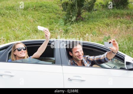 Couple taking selfies Stock Photo