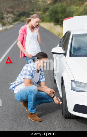 Couple after a car breakdown Stock Photo