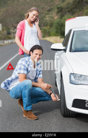 Couple after a car breakdown Stock Photo