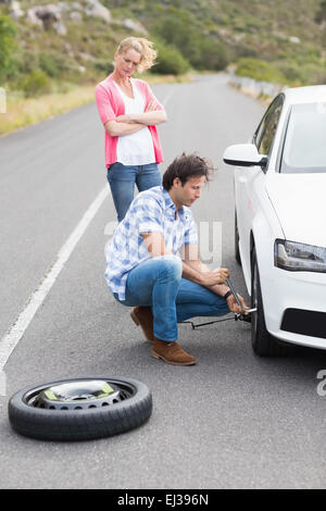 Couple after a car breakdown Stock Photo