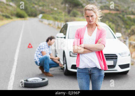 Couple after a car breakdown Stock Photo
