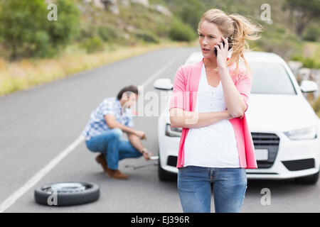 Couple after a car breakdown Stock Photo