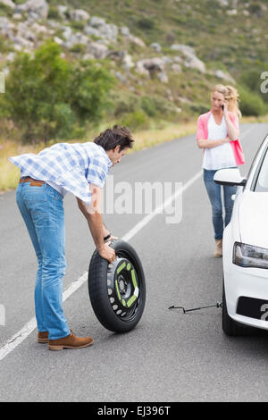 Couple after a car breakdown Stock Photo
