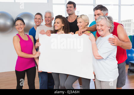 Friends holding blank together Stock Photo