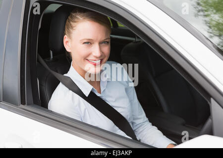 Happy businesswoman in the drivers seat Stock Photo