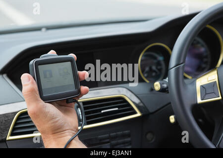 Man using satellite navigation system Stock Photo