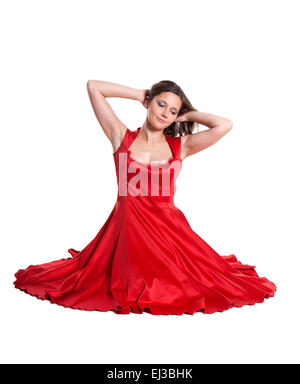 Beautiful woman sitting on the floor, white background Stock Photo