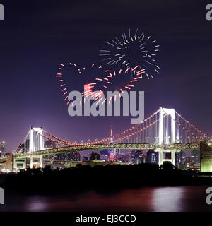 heart sparkle Fireworks celebrating over Tokyo Rainbow Bridge at Night, Odaiba, Japan Stock Photo