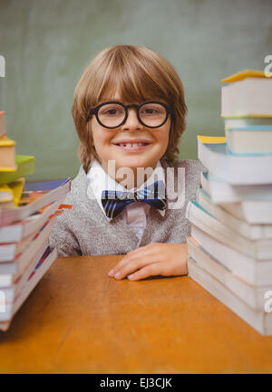 Schoolboy in glasses with stack of books Stock Photo - Alamy