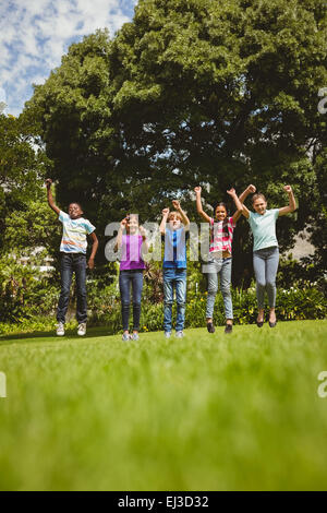 Children jumping at park Stock Photo