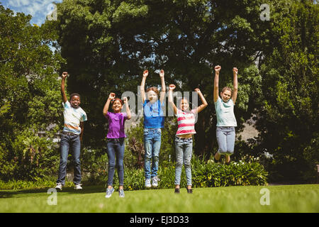 Children jumping at park Stock Photo