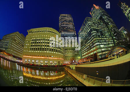 Office buildings and skyscrapers including One Canada Square around Canary Wharf at sunset, Isle of Dogs, London, England Stock Photo