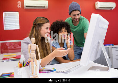 Team working at desk with colour samples Stock Photo