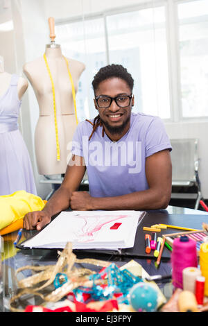 Attractive male fashion designer sketching Stock Photo