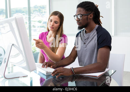Creative team using computer Stock Photo